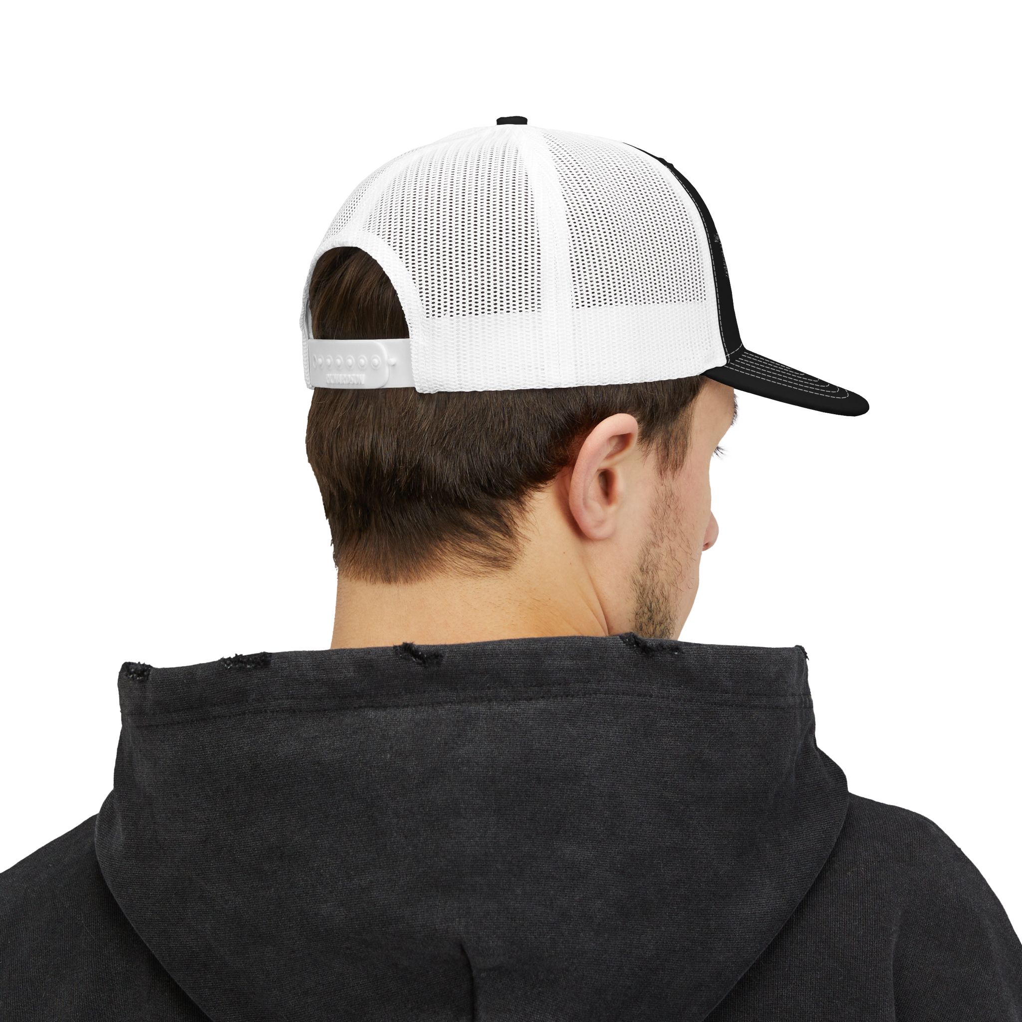 A person is shown from behind, wearing a black hoodie and the Embroidered Trucker Snapback Cap — Classic Mesh Baseball Hat, facing away from the camera.