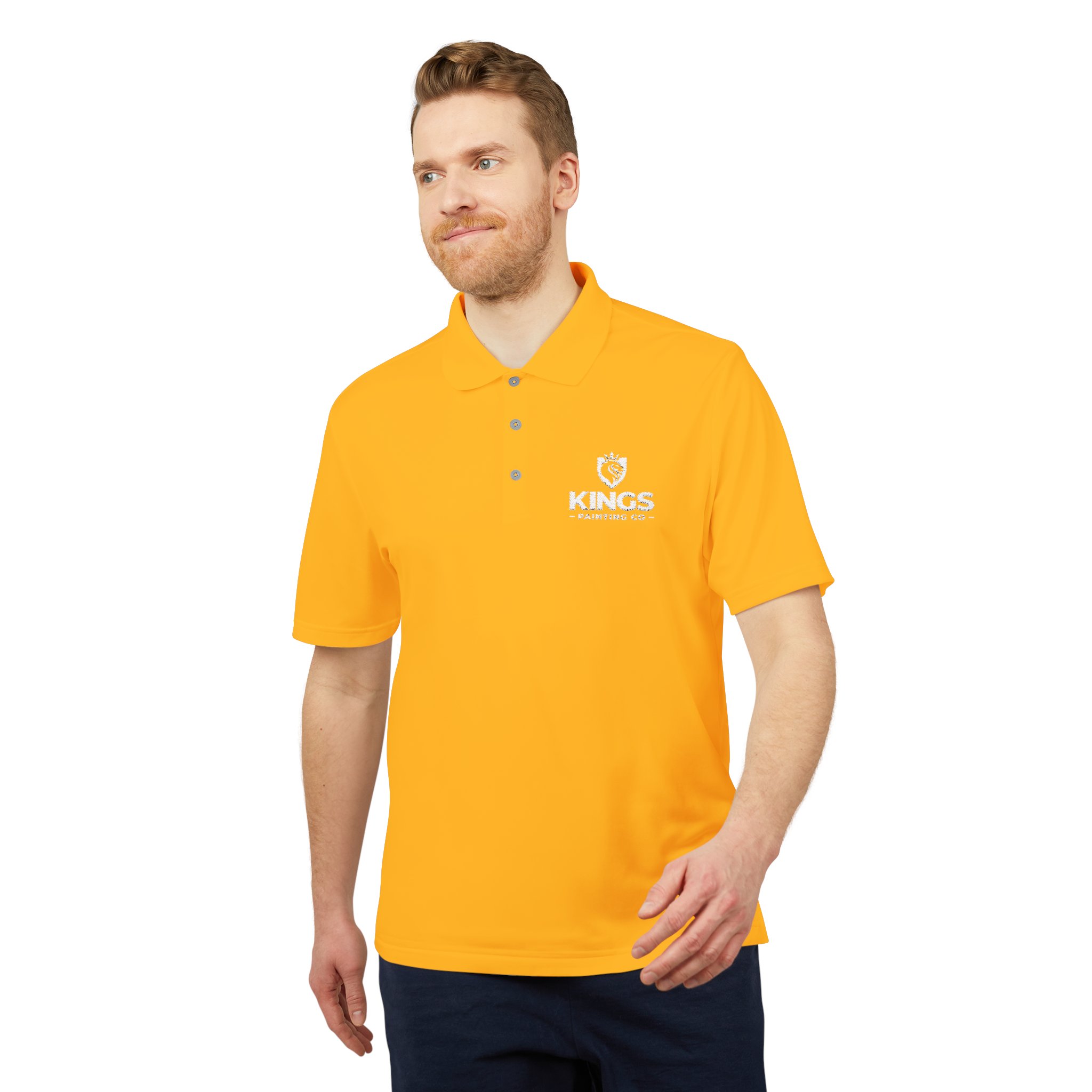 A man wearing a bright yellow Kings Painting Co. Performance Polo by Under Armour®, featuring a white KINGS logo and crown emblem on the left chest, stands against a plain white background.